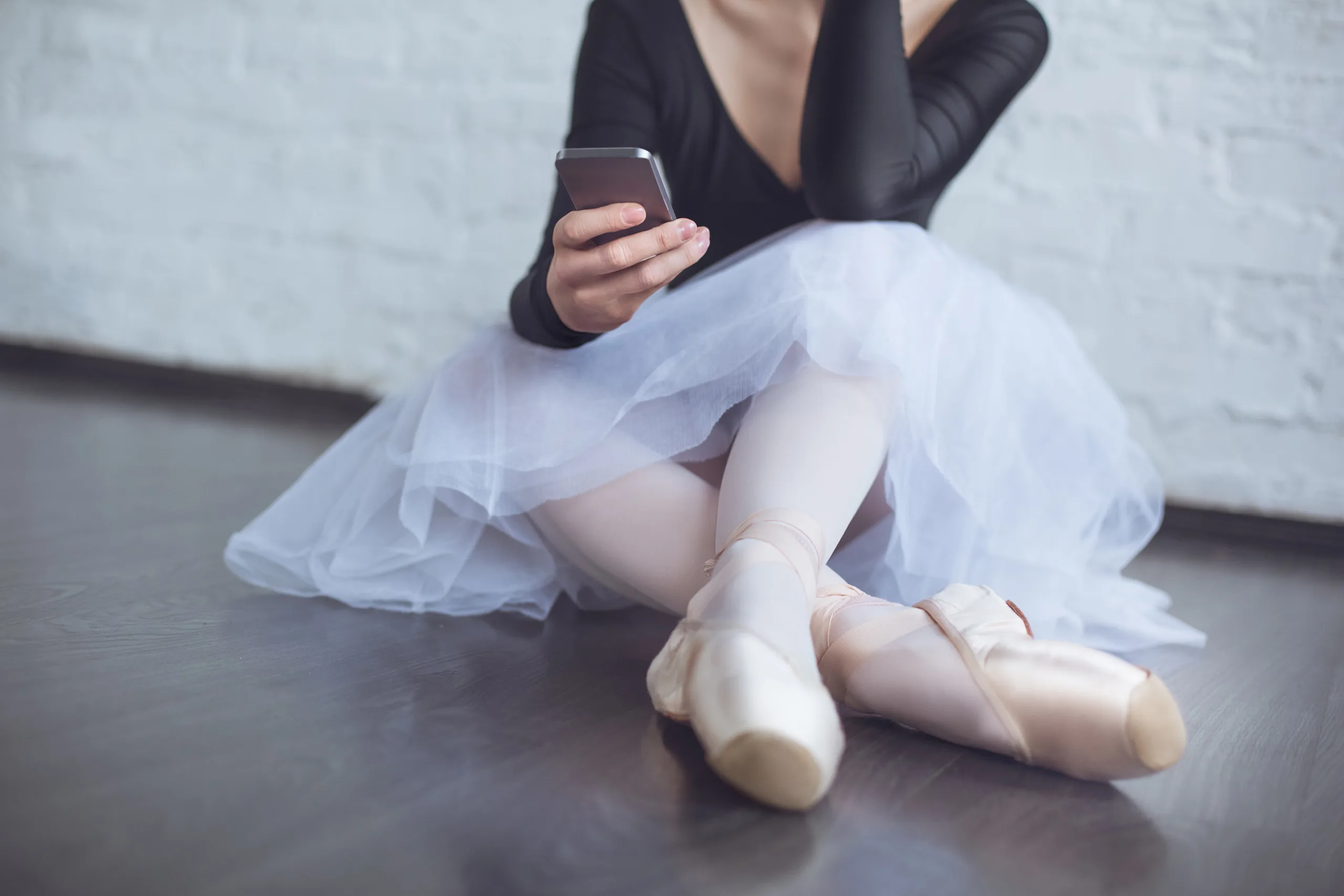 A dancer mid-movement in a studio.